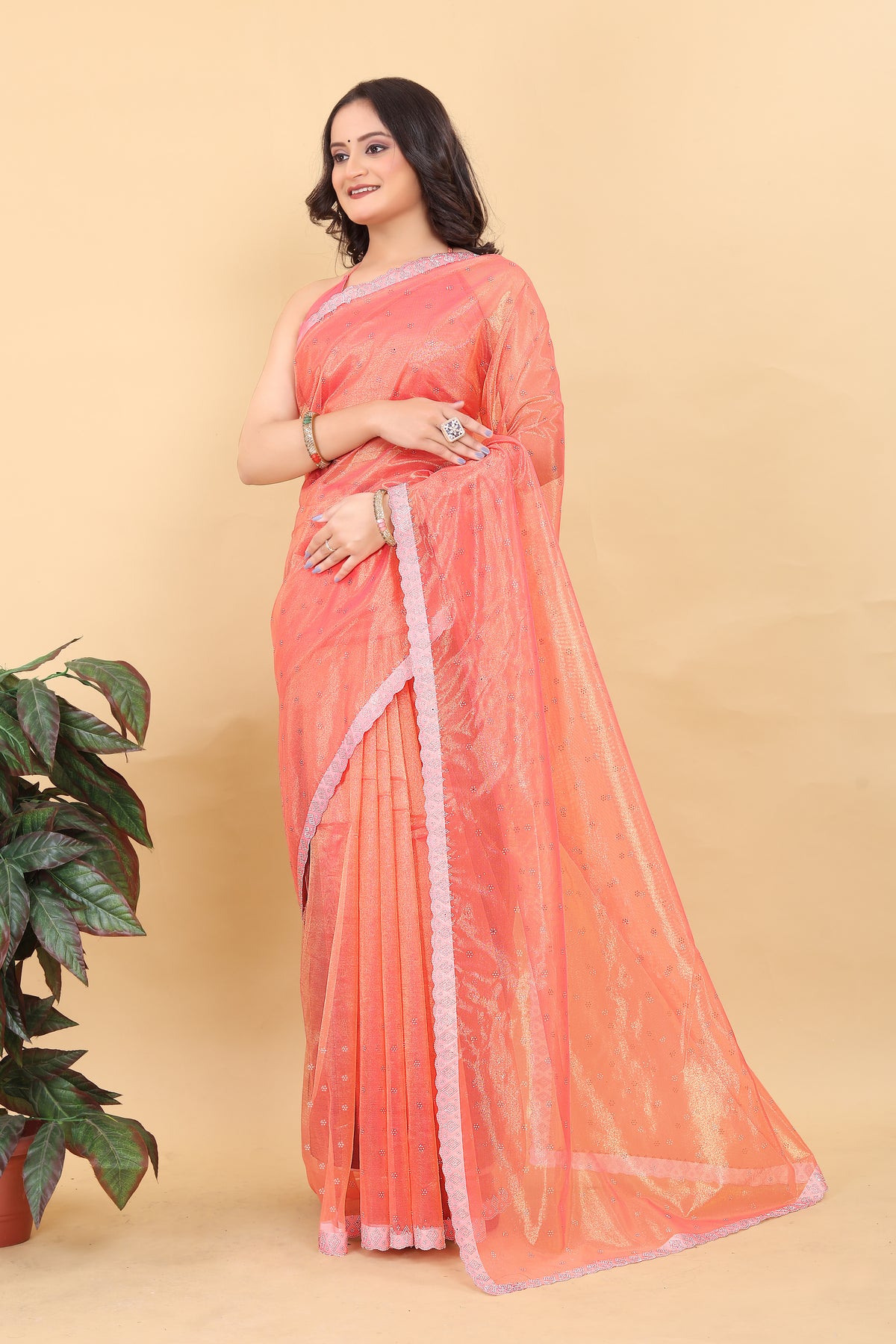 Elegant Peach Net Saree with Pink Lace Border