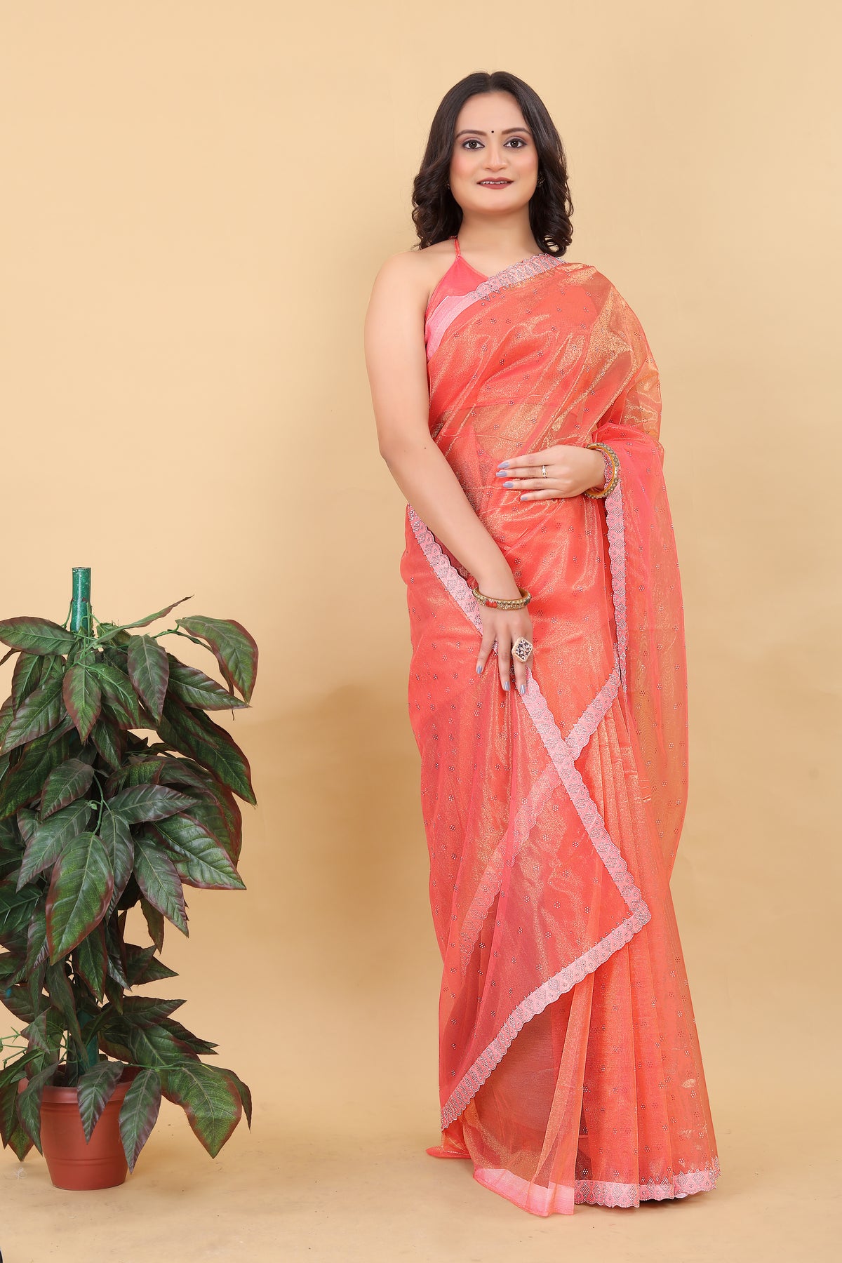 Elegant Peach Net Saree with Pink Lace Border