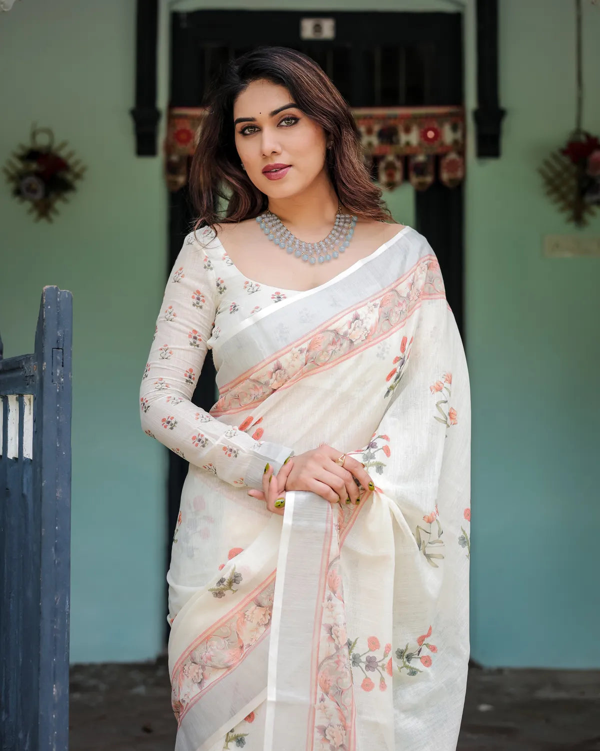 Ivory Pure Cotton Linen Saree with Pastel Floral Design And Tassel Detailing With Unstitched Blouse