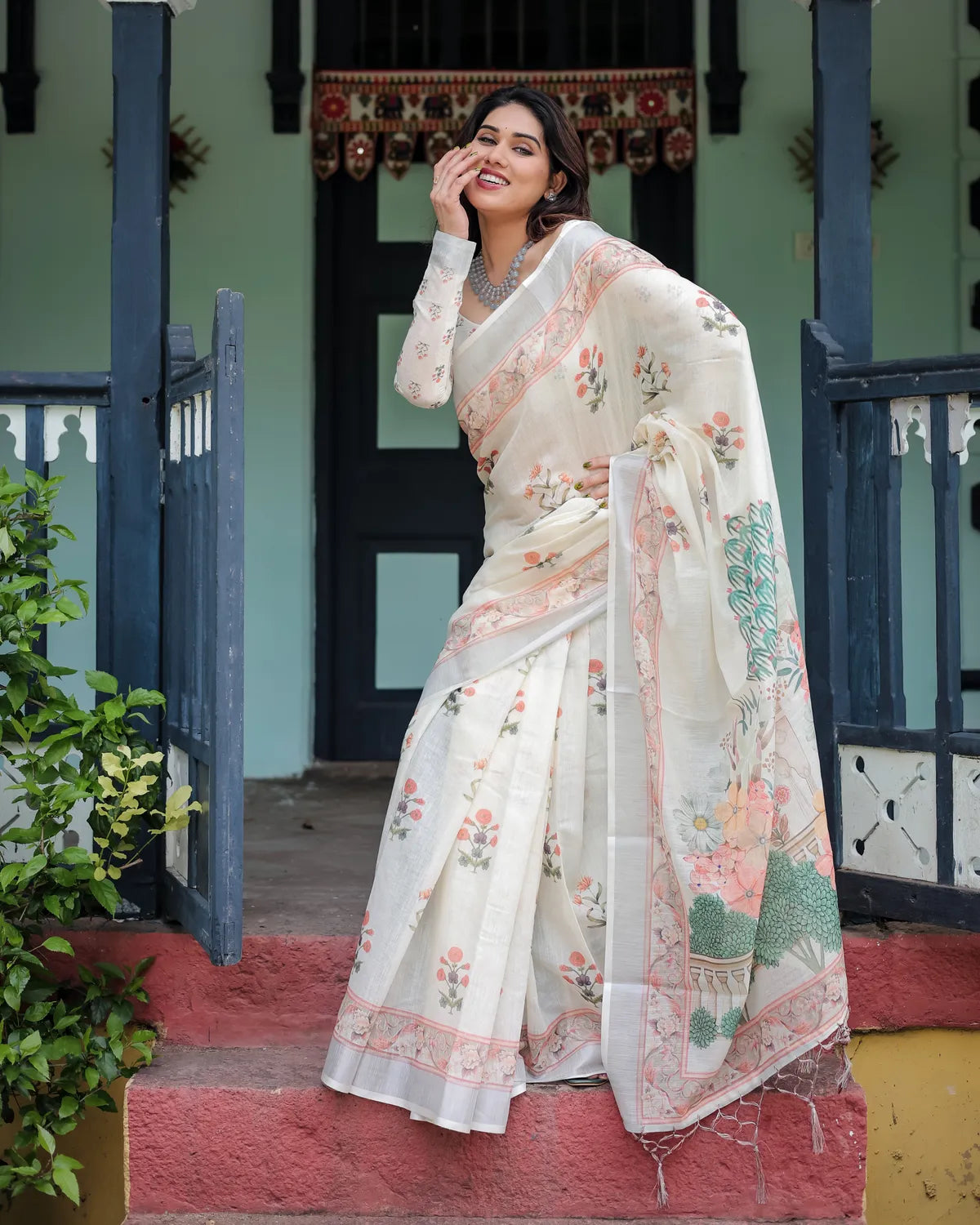 Ivory Pure Cotton Linen Saree with Pastel Floral Design And Tassel Detailing With Unstitched Blouse